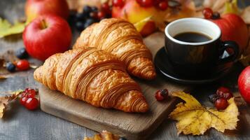 Freshly baked croissants on a wooden board with a steaming cup of coffee in a cozy cafe photo