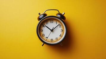 Bright yellow clock on a matching saucer showcasing a modern aesthetic and playful design photo
