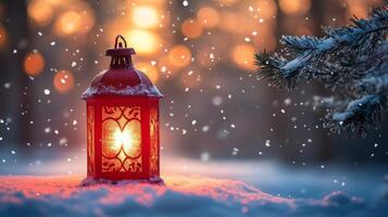 A red lantern illuminating falling snowflakes in a winter forest at dusk photo