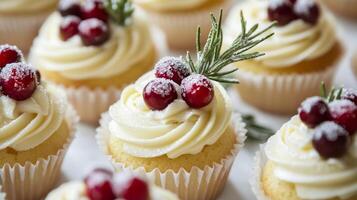 Delicious holiday vanilla cupcakes decorated with cranberries and rosemary on a festive table photo