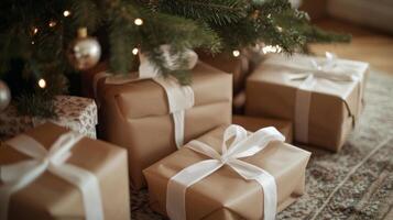 Beautifully wrapped gifts under a Christmas tree adorned with soft lights and festive decorations photo