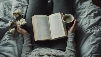 Cozy winter afternoon with a book and coffee, surrounded by flowers in a warm bed setting photo