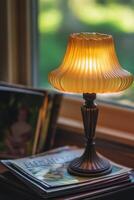 Soft, warm light illuminating a vintage lamp beside magazines on a cozy table in a sunlit room photo