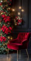 Cozy red chair in a festive room decorated with a Christmas tree and poinsettias photo