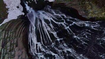 Stream of Terskol waterfall from the drone from top to bottom video