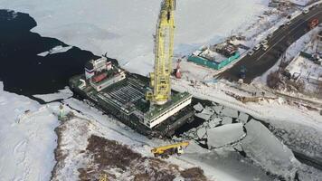 Drone view of a floating crane that carries a truck from one coast to another video