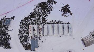Aerial view top down of the mountain climber shelters on the Mount Elbrus video
