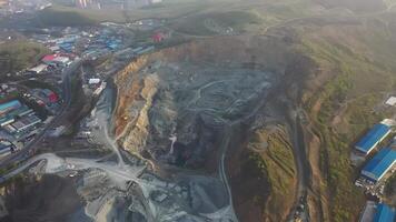 Aerial. Big crusher working with rubble at a quarry, moving it on a line. video