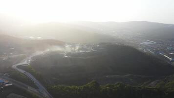 Big crusher working with rubble at a quarry, moving it on a line. video