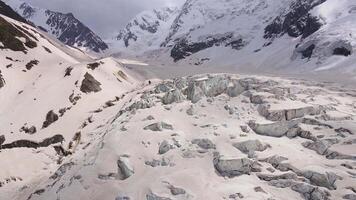 Cracks and blocks of ice on the glacier high in the mountains video