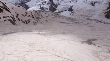 Cracks and blocks of ice on the glacier high in the mountains video