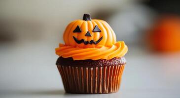 Festively decorated Halloween cupcakes with orange frosting and pumpkin toppers on a table photo