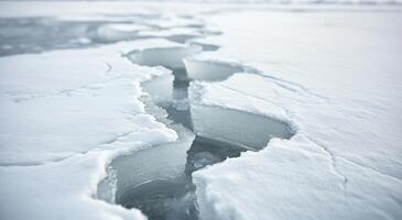 Cracked ice formations on a frozen lake during winter's twilight photo