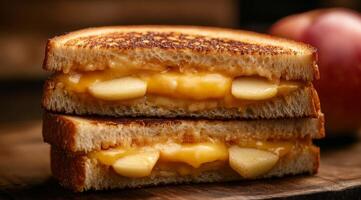 Delicious grilled cheese sandwich with apple slices on toasted bread, ideal for a comforting snack photo