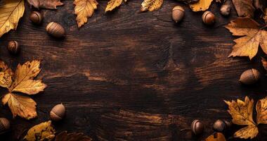 Autumn leaves and acorns arranged on a rustic wooden table creating a seasonal display photo