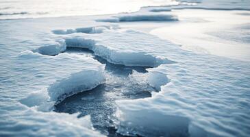 Cracked ice formations on a frozen lake during winter's twilight photo