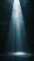Radiant beams of light shining through a dark space with floating particles in the air photo
