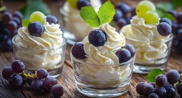 Delicious purple grape mousse served in small glasses with fresh mint leaves on a rustic table photo