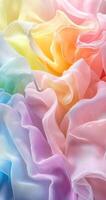 Colorful ruffled fabric in soft pastels creating a dreamy texture in warm light photo