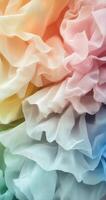 Colorful ruffled fabric in soft pastels creating a dreamy texture in warm light photo