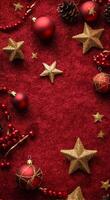 Festive red background with Christmas ornaments, gold stars, and sparkles for holiday decorations photo