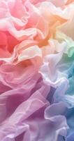 Colorful ruffled fabric in soft pastels creating a dreamy texture in warm light photo
