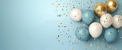 Festive balloons with gold and blue colors against a light blue background for celebration photo