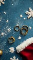 Festive flat lay featuring a Santa hat and holiday decorations on a blue background photo