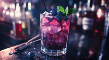 Vibrant cocktail with blueberries and mint served in a tall glass at a lively bar during the evening photo