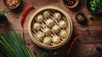 Delicious steamed dumplings served in a bamboo basket on a rustic wooden table photo