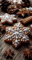 Gingerbread snowflake cookies and cinnamon sticks on a wooden table for winter fun photo