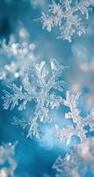 Delicate snowflake resting on glistening winter surface with blurred blue background photo