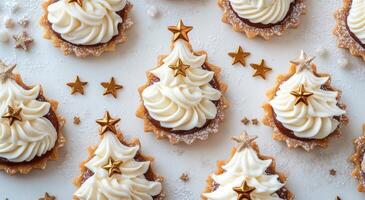 Festive mini dessert trees decorated with golden stars on a white table with pinecones photo