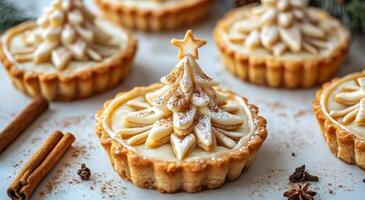 Festive holiday dessert featuring intricately decorated tree-shaped tarts on a winter table photo