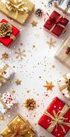 Wrapped Christmas gifts arranged on a festive black background with ornaments photo