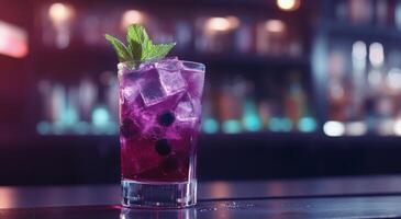Refreshing blueberry cocktail served in a glass with mint garnish at a cozy bar in the evening photo