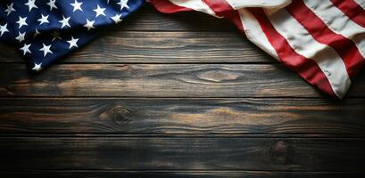American flag draped over rustic wooden surface in a calm, patriotic setting photo