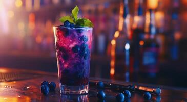 Vibrant cocktail with blueberries and mint served in a tall glass at a lively bar during the evening photo