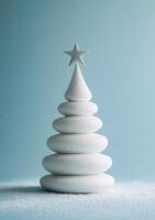 White ceramic Christmas tree decoration on a soft blue background in a minimalist style photo