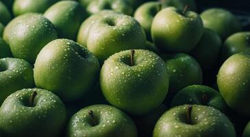 Fresh green apples stacked in a market display showcasing vibrant colors and textures photo