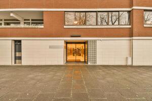 A building with a door and a window in front of it photo