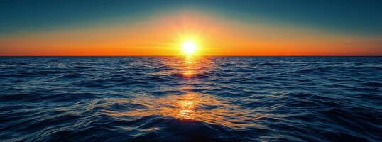 Beautiful sunset over the ocean showcasing vibrant colors and calming waves in the evening photo
