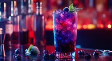 Vibrant cocktail with blueberries and mint served in a tall glass at a lively bar during the evening photo