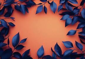 Decorative blue leaves arranged on an orange background for artistic display or design projects photo