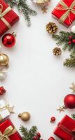 Festive holiday arrangement with red gifts, ornaments, and pine branches on a white background photo