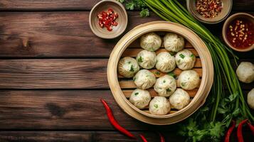 Delicious steamed dumplings served in a bamboo basket on a rustic wooden table photo