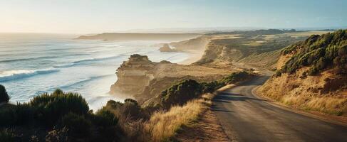 Scenic coastal highway overlooking the ocean during a sunny day in the afternoon photo