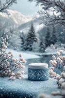 Winter skincare product displayed amid snow-covered pine branches and mountains in the background photo
