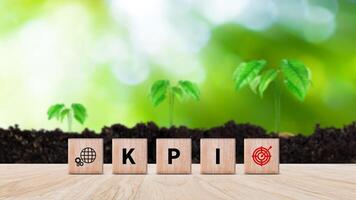 KPI text in wooden cube, Key Performance Indicator concept, Management data System KPI connected database follow earnings, Financial business data analytics graph dashboard. photo