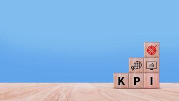 KPI text in wooden cube, Key Performance Indicator concept, Management data System KPI connected database follow earnings, Financial business data analytics graph dashboard. photo